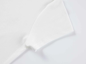 Macro detail of high-quality stitching on white modal short-sleeved slim-fit t-shirt sleeve