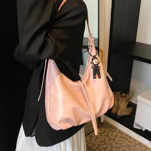Pink large capacity hobo shoulder bag with a cute doll pendant in a stylish casual look