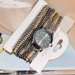 Elegant vintage-style black and gold quartz watch with minimalist multi-strand chain bracelet