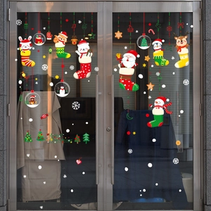 Christmas window decals with Santa and Reindeer designs on double glass doors
