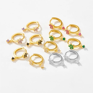 Detailed view of colorful flower charm hoop earrings in gold and silver plating