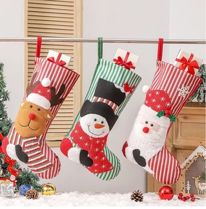 Three knitted Christmas stockings with 3D Santa, Snowman, and Reindeer felt appliques