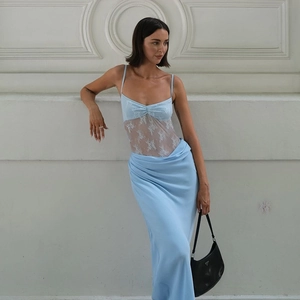 Detail of light blue mesh patchwork dress with white lace waist and satin skirt