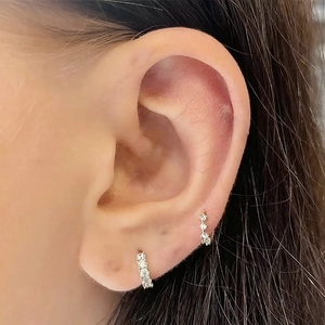 Close-up of S925 sterling silver hoop earrings with micro-inlaid cubic zirconia