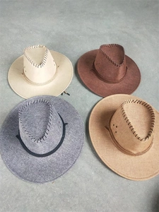 Detail of four linen-textured cowboy hats in beige, brown, and grey with decorative stitching