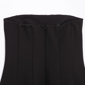 Back view of black off-the-shoulder mini dress featuring an invisible zipper closure