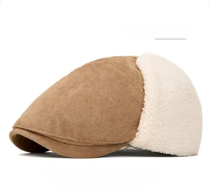 Detail view of winter newsboy hat in light khaki faux suede with white fleece ear flaps
