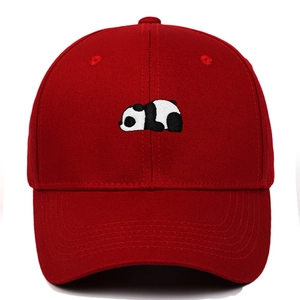 Close-up of detailed panda embroidery on a dark red cotton twill baseball cap