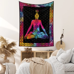 Macro detail of Bohemian meditation tapestry featuring chakra symbols and star texture