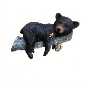 Resin black bear figurine sleeping on a tree branch for garden decoration 23.5cm