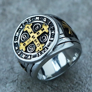 Macro shot of stainless steel St. Benedict cross ring with tri-color relief detail