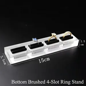 Acrylic 4-slot ring display stand with black velvet inserts and brushed texture base