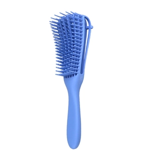 Detail of the blue 8-claw detangling hair brush with ventilated hollow design for styling