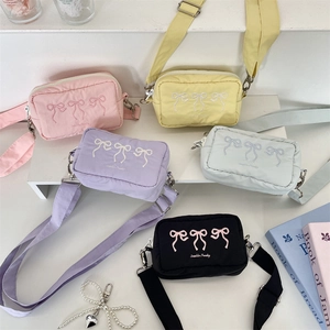 Detailed collection of embroidered bow crossbody bags in five soft pastel colors