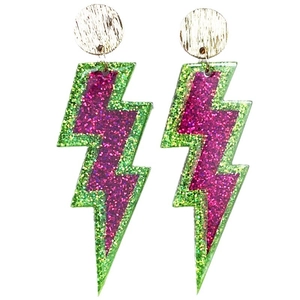 Macro view of neon lightning earrings featuring pink and green glitter textures and gold studs