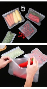 Detail of eco-friendly translucent silicone storage bags filled with fresh vegetables