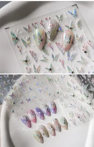 Detailed view of TL-184 laser nail stickers with iridescent butterfly and tulip patterns