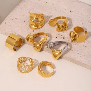 Collection of modern 18K gold plated stainless steel rings in minimalist and liquid styles