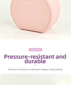 Close-up of pink portable leather jewelry box featuring pressure-resistant durable material