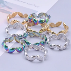 Adjustable leaf-shaped stainless steel rings in gold, silver, and rainbow colors