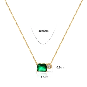 Detailed view of emerald-cut green gem and round zircon necklace with size measurements
