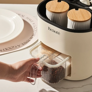 Rotating kitchen seasoning rack with ceramic jars and bamboo lids in cream white