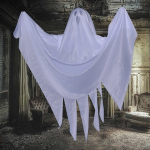 Hanging white ghost Halloween decoration with fabric tassels in a spooky haunted house setting