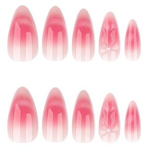 Faux ongles œil de chat rose avec nœuds 3D et perles sur forme en amande