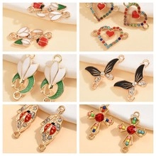 Detail of assorted enamel and rhinestone alloy charms including hearts and flowers