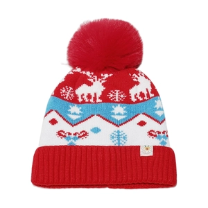 Detail of red Christmas knit hat featuring reindeer jacquard and a large fluffy pompom