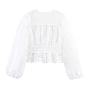 Detailed view of floral hollow lace long sleeve top with scalloped edge and cinched waist