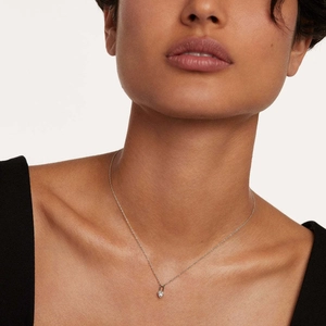 S925 sterling silver heart lock necklace with gold finish on a model, elegant jewelry