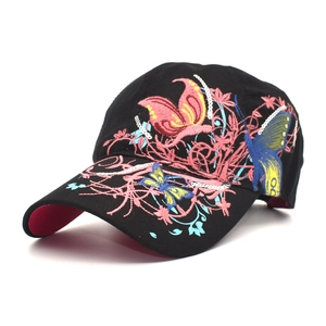 Detail of colorful butterfly and flower embroidery with sequins on black baseball cap