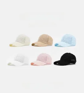 Detail of soft feathered baseball caps in six colors including beige khaki and pink