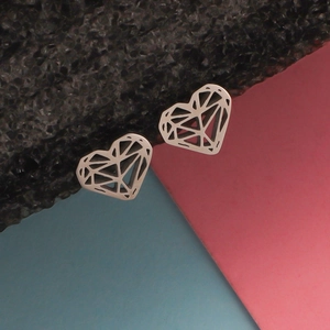 Detailed view of silver minimalist hollow heart-shaped stainless steel stud earrings
