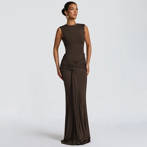 Detail of elegant dark brown maxi dress featuring twisted waist and ruched fabric design