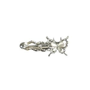 Silver alloy butterfly hair clip with shimmering cat eye stones and wave design