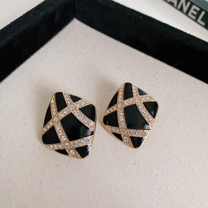 Vintage black enamel diamond-shaped earrings with gold grid and crystal accents