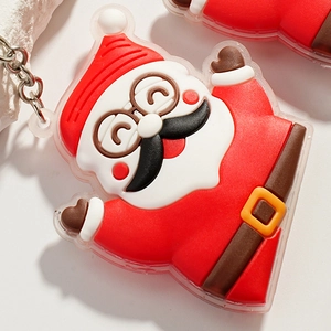 Close-up of a 3D Santa Claus silicone pendant with a sturdy metal keychain and chain