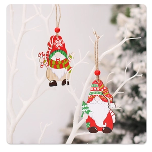 Detailed view of hand-painted wooden gnome ornaments hanging on winter branches