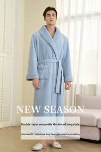Detail of light blue fleece bathrobe showing thick double-layered plush fabric and belt