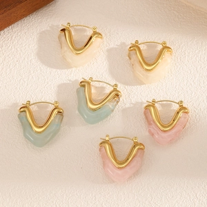 Three pairs of resin heart earrings in cream, blue, and pink with golden V-shaped buckles