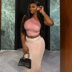 Women's two-piece set featuring a pink one-shoulder crop top and gradient mesh maxi skirt