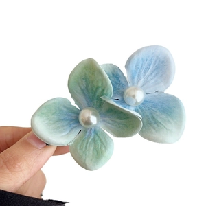 Mint green orchid hair clip with faux pearls for summer seaside vacation and beach photography