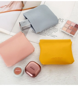 Detailed lifestyle view showing colorful PU leather pouches for makeup and accessories