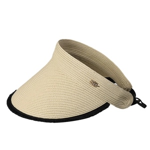 Foldable straw sun visor hat with wide brim, golden leaf detail and black trim design