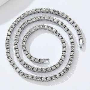 Close-up of a silver hip hop tennis necklace with sparkling zircons and secure clasp