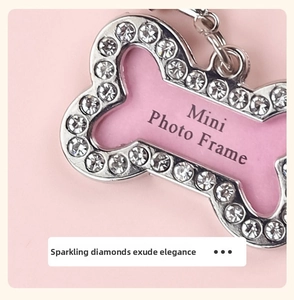 Macro shot of bone-shaped pink pet mini photo frame with sparkling diamond-studded frame