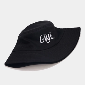 Classic black bucket hat with white Gigi embroidery and heart detail on plain background