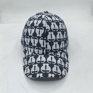Dark blue baseball cap featuring all-over white cat silhouette patterns for sun protection